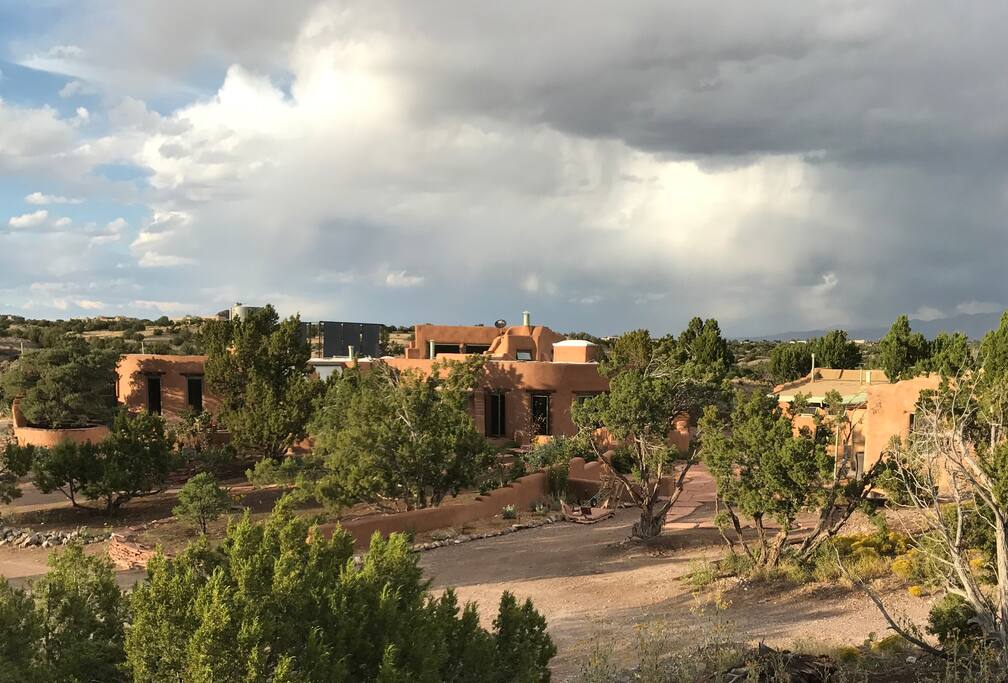 The compound with house on the left and casita and studio on the right