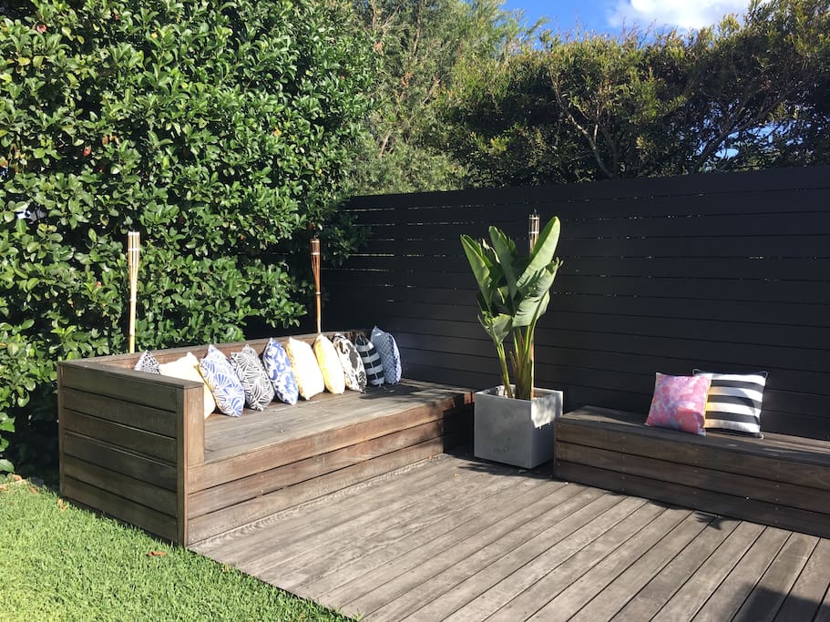 Beautiful daybed and bench seating bathed in sunlight