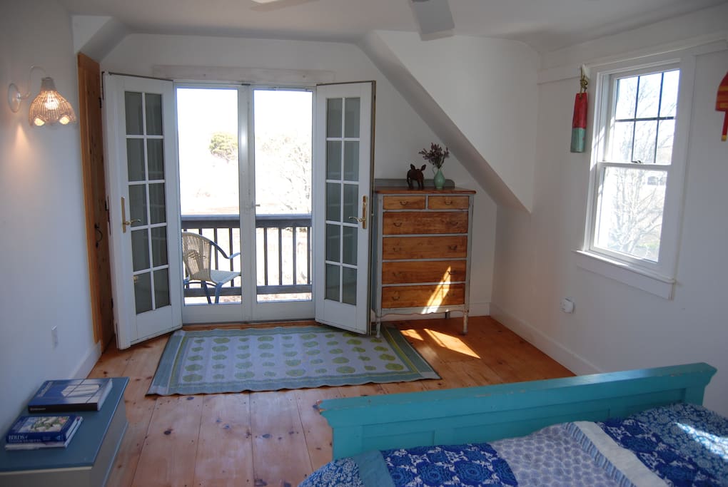 Master bedroom, balcony overlooking marsh and slight views of Stage Harbor