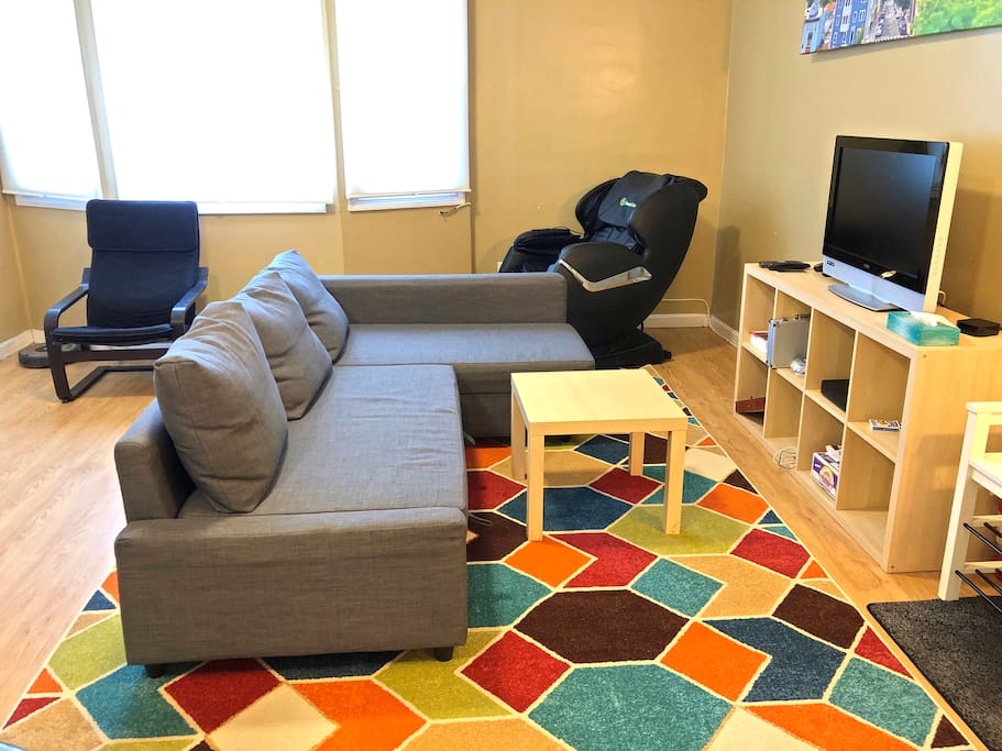 living room, with pull out couch (full size) and the massage chair