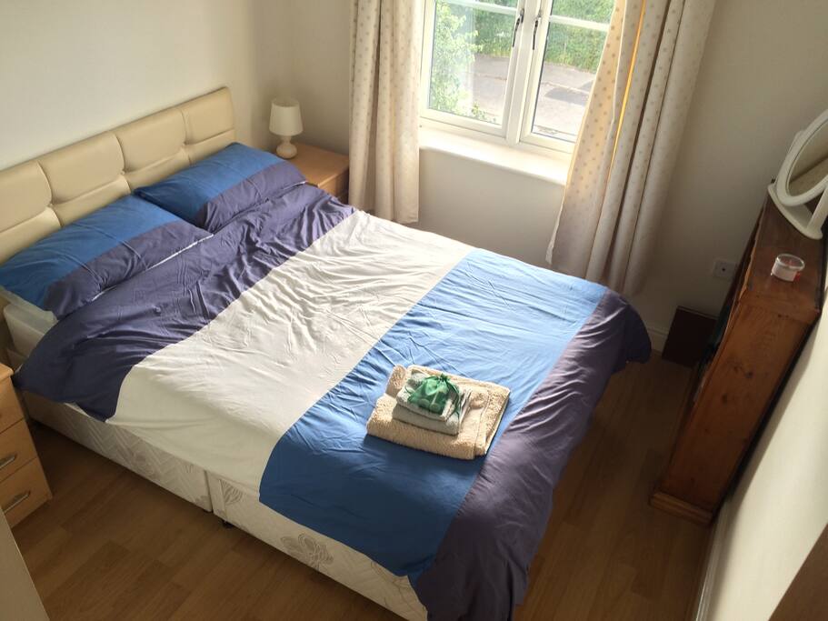 Your double room. Complete with drawers and a wardrobe to store your things in.