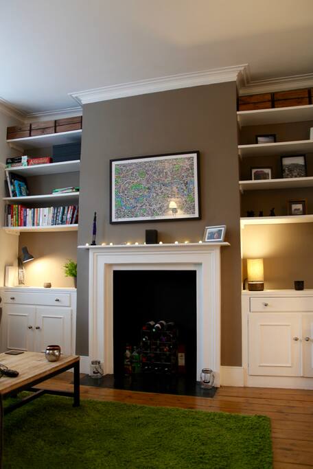Beautiful old fireplace takes centre stage in the living room.