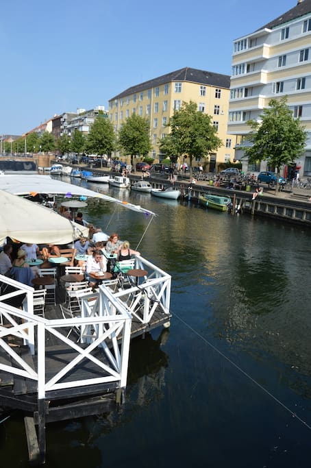 People enjoying themselves in the canal café