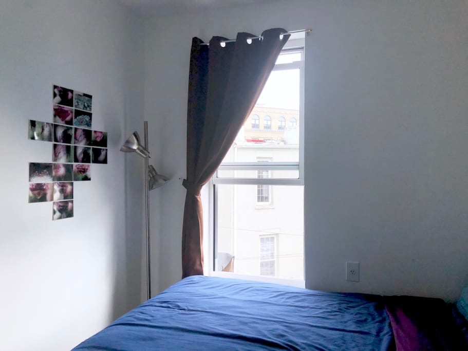 Comfy full-sized bed, fresh sheets and large, bright window
