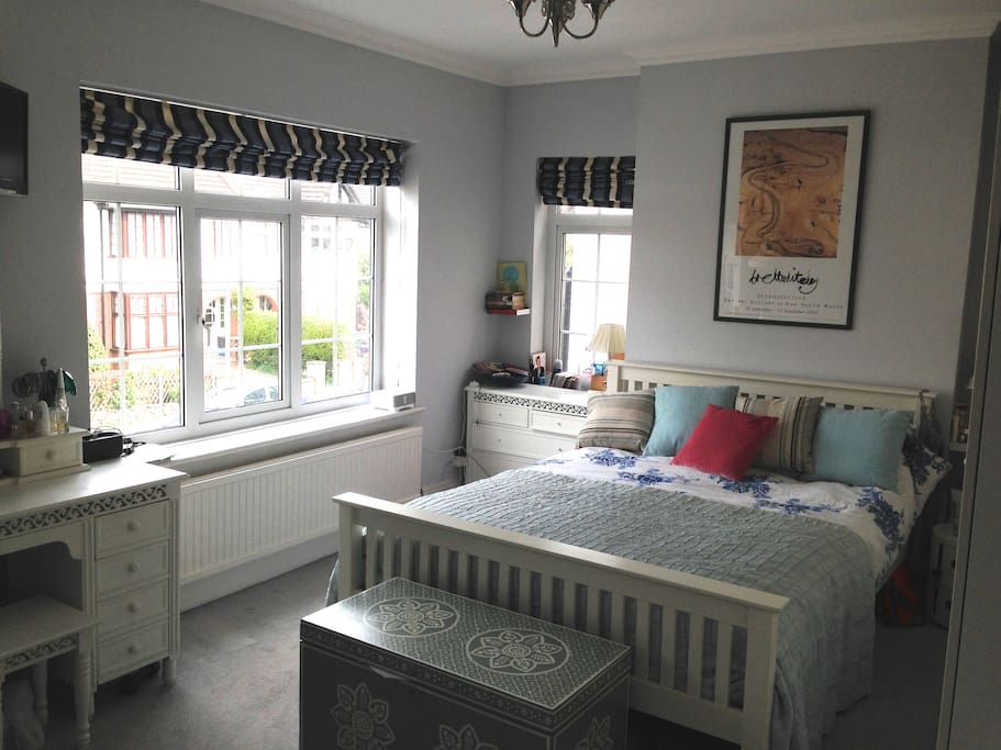 Double bedroom - king size double at the front of the house, 1st floor, with wall to ceiling wardrobes on one side and dressing table