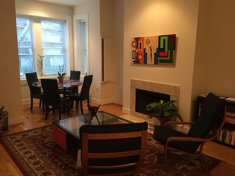 Living room and dining area. Living room features Apple TV with access to thousands of TV shows and movies.