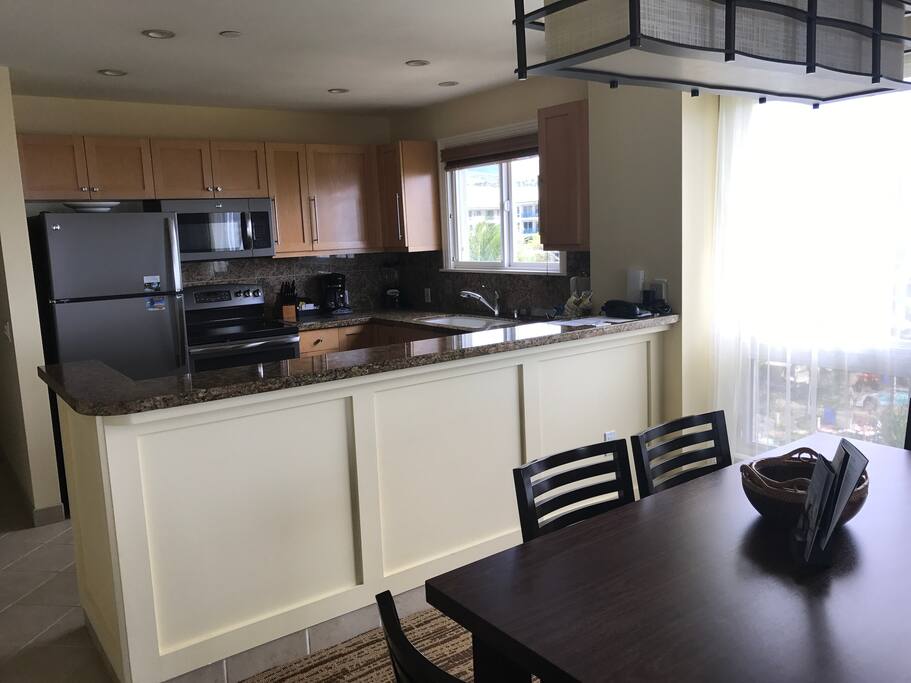 View from living room through dining room to kitchen