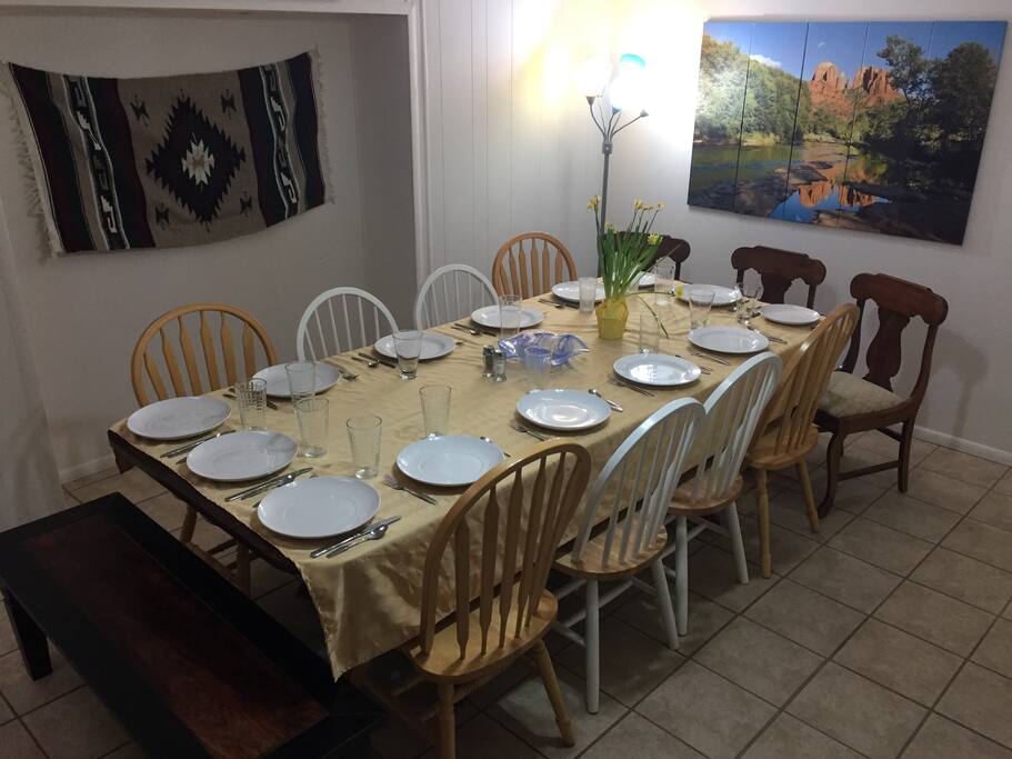 Large dining room table seats 14 comfortably! Can move breakfast nook table next to it to seat 20 together.