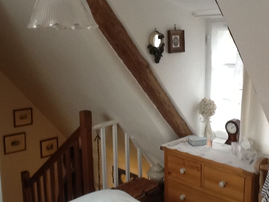 bedroom with stairs down