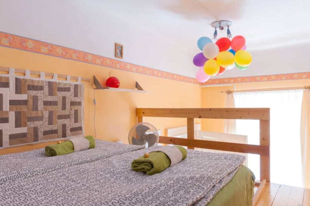 Your private bedroom with comfortable mattress is waiting for you. The wall carpet is made by my mother. Do you like it?
