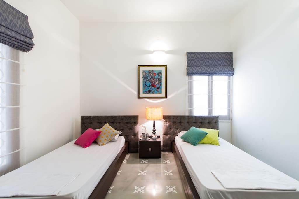 Bedroom overlooking green backyard
