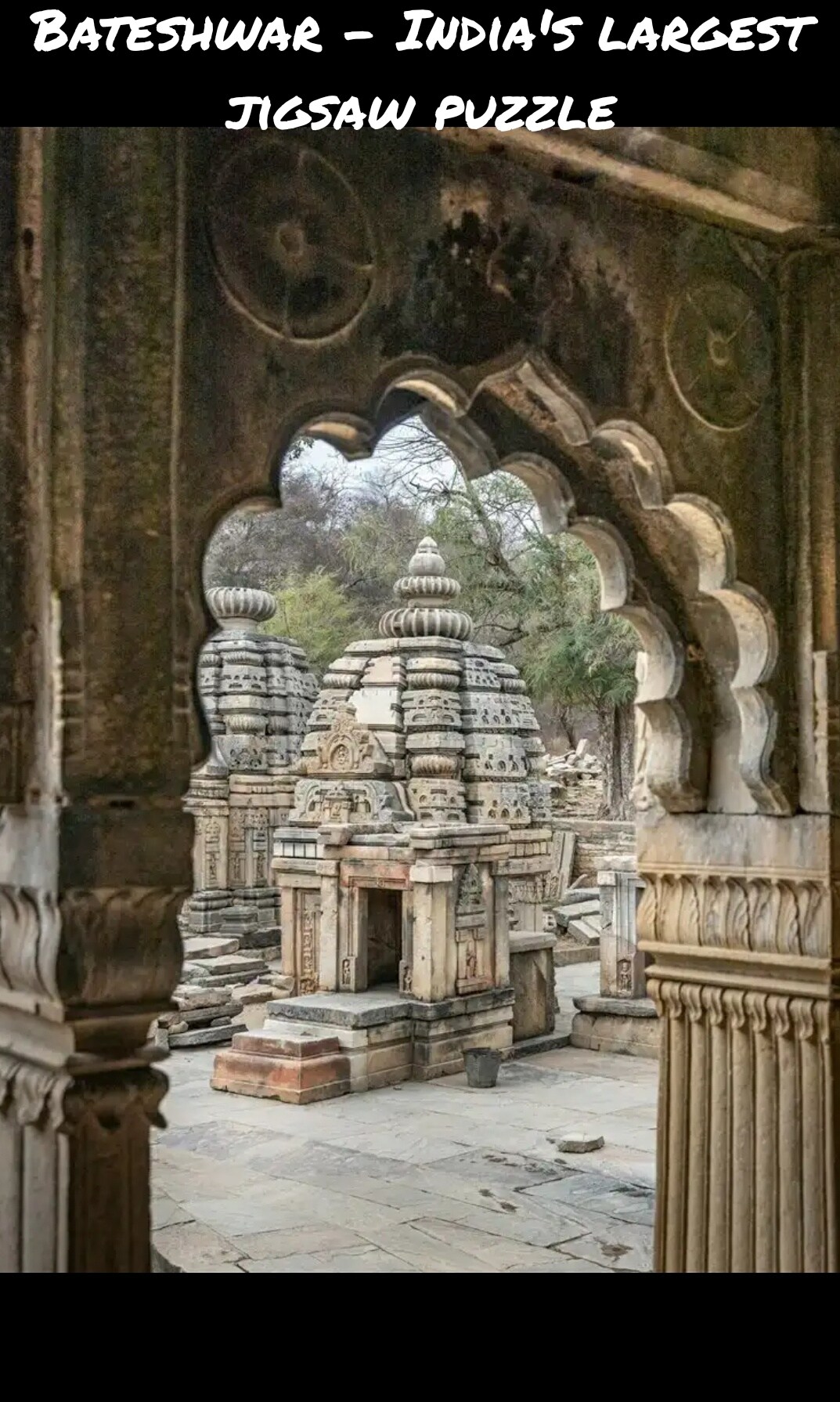 Intricately carved stone structures are framed by an ornate archway, showcasing the intricate details of Bateshwar temples. The site unfolds in layers, revealing multiple temples surrounded by lush greenery, creating a serene and historical atmosphere.
