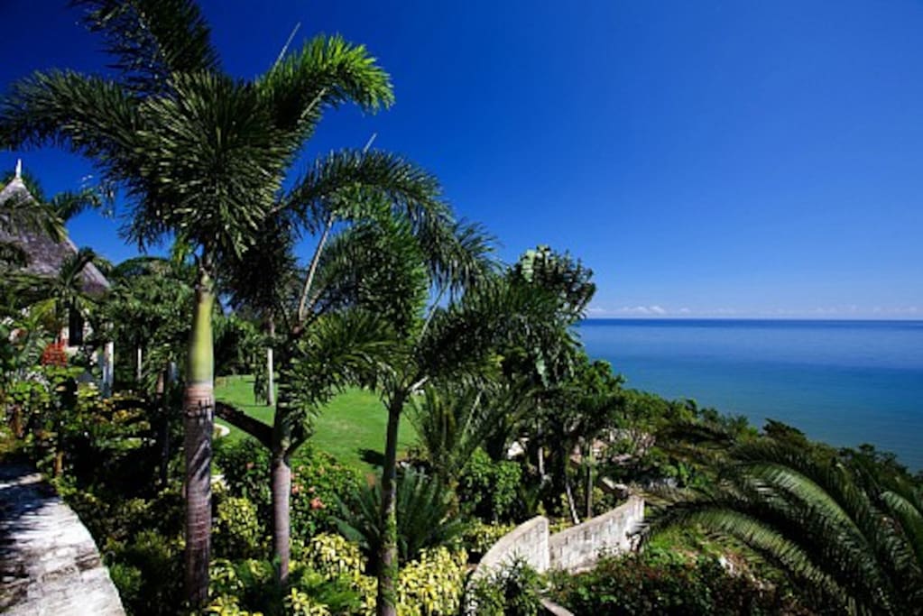 It reigns over a steep hillside. The view of the harbor, passing cruise ships and the town of Montego Bay 12 miles east is an unimpeded sweep of deep blue sea.
Refreshing non-stop trade winds cool the hill and sing through the Royal Palms.