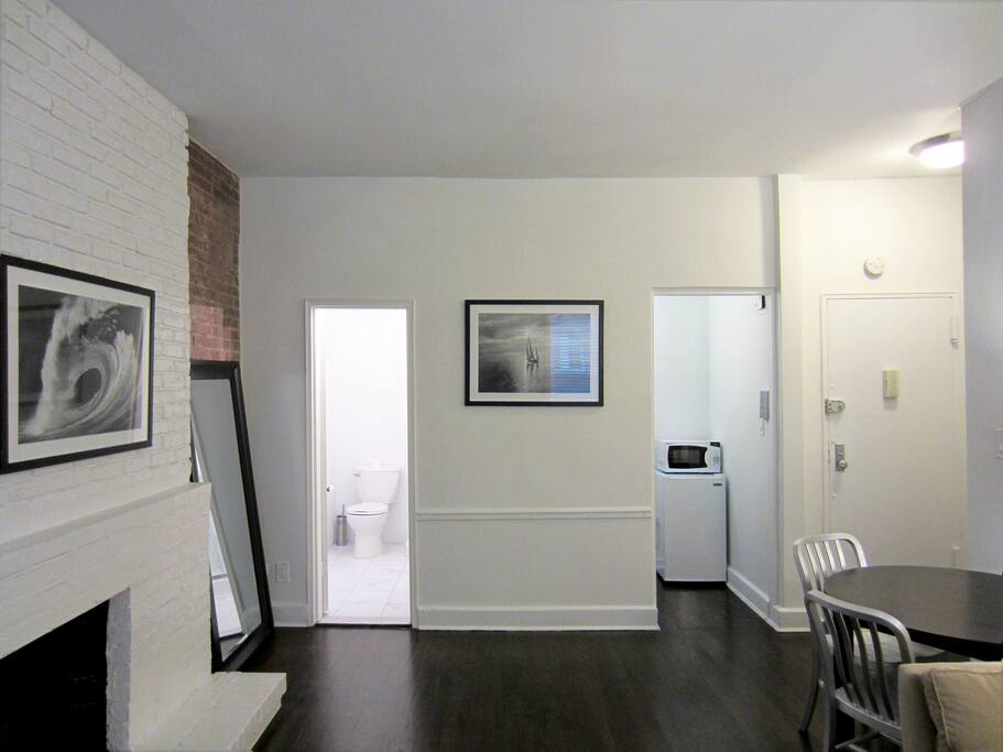Living room, kitchen, bathroom, and entry door