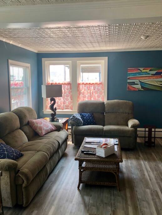 Front room/common area. Lovely tin ceiling!