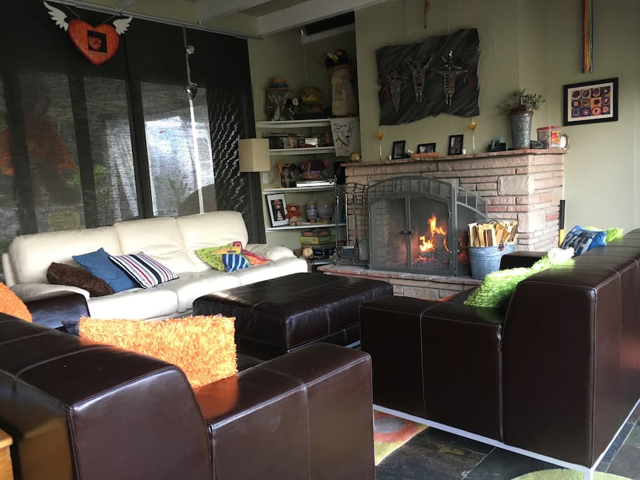 Living room with a fireplace. Great for gatherings or quiet time by the fire!