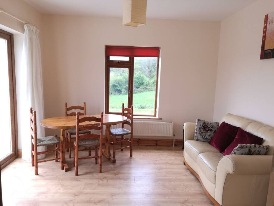 Lounge and dining area with patio doors
