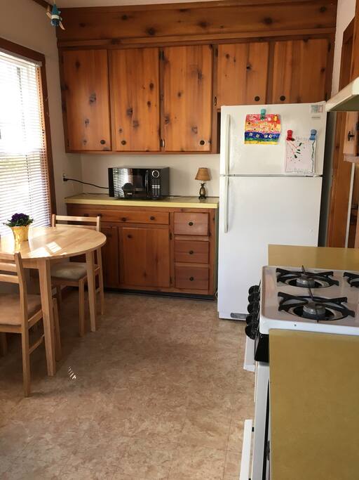 Enjoy breakfast at the small kitchen table, which can pull out to accommodate 4 guests.