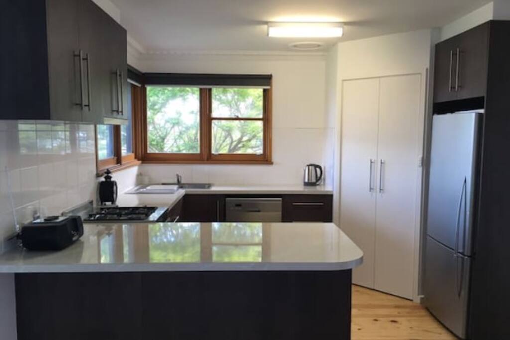 Kitchen has stainless appliances, & a large pantry.