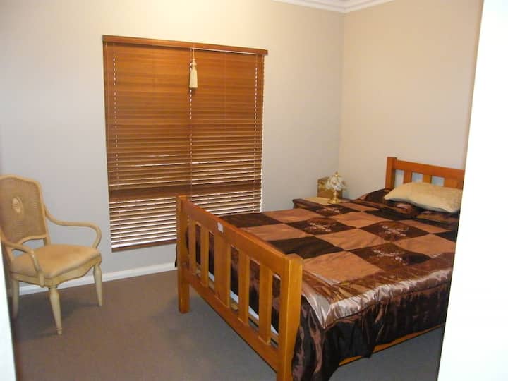 Queen bedroom with double robe and close to the bathroom