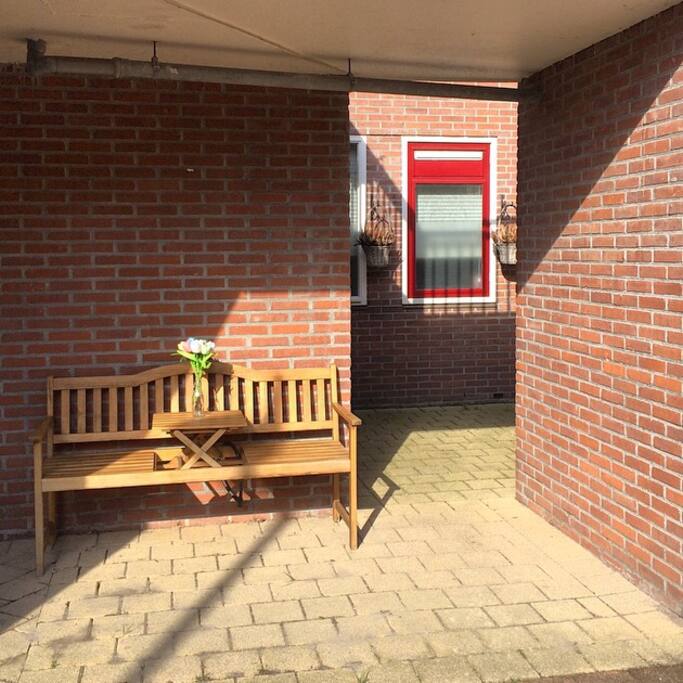 The front door is located here. Lovely to drink some coffee on the bench during sunny mornings.