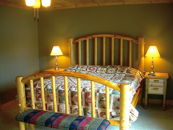 Master bedroom with glass door to deck.  Dish TV.