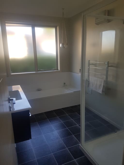 Private bathroom with shower and bath.