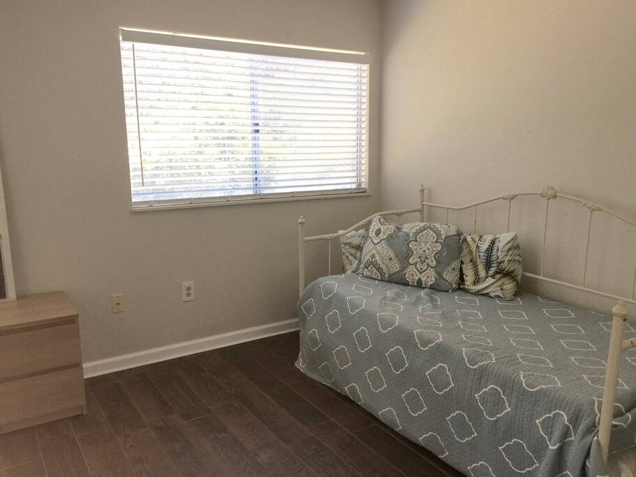 Guest Bedroom with large window for cool breezes