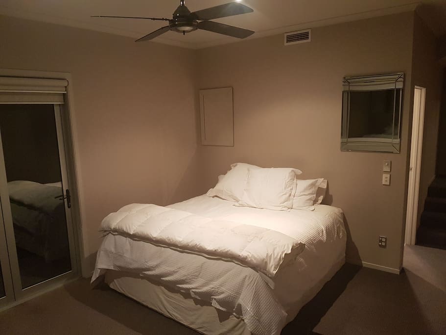 Super King bed with ceiling fan and gas central heating system for comfort