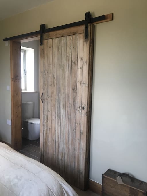 Sliding door to the ensuite wet room with shower