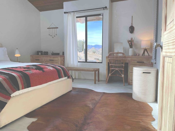 Bedroom 5 - queen bed in another bright and airy space with vanity / desk area. 