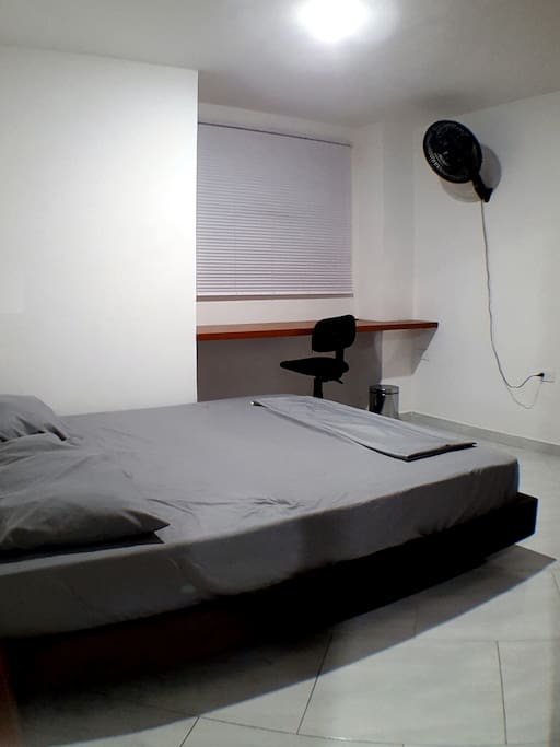 2nd Bedroom
Inventory: Queen Size Bed (160cm X 190cm), Wood Bed Frame, 400 Count Microfibre Bedding in Grey, 2 Pillows Medium Density, Large Closet Space, Custom Built Corner Workspace, Desk Chair with Wheels, Trash Can, Wall Mounted Air Circulating Fan, 30 Wooden Hangers