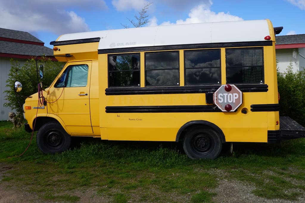 The Cool Bus has a private bamboo garden with solar lights, lawn chairs, and a glass table.