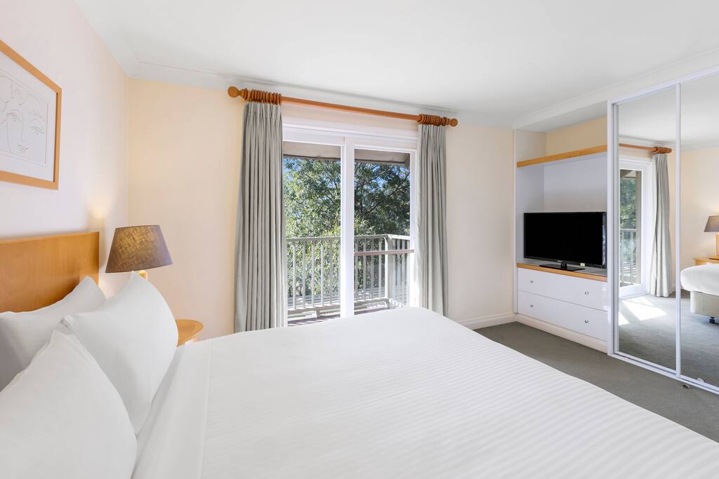2 Bedroom Villa: Bedroom with access to private balcony