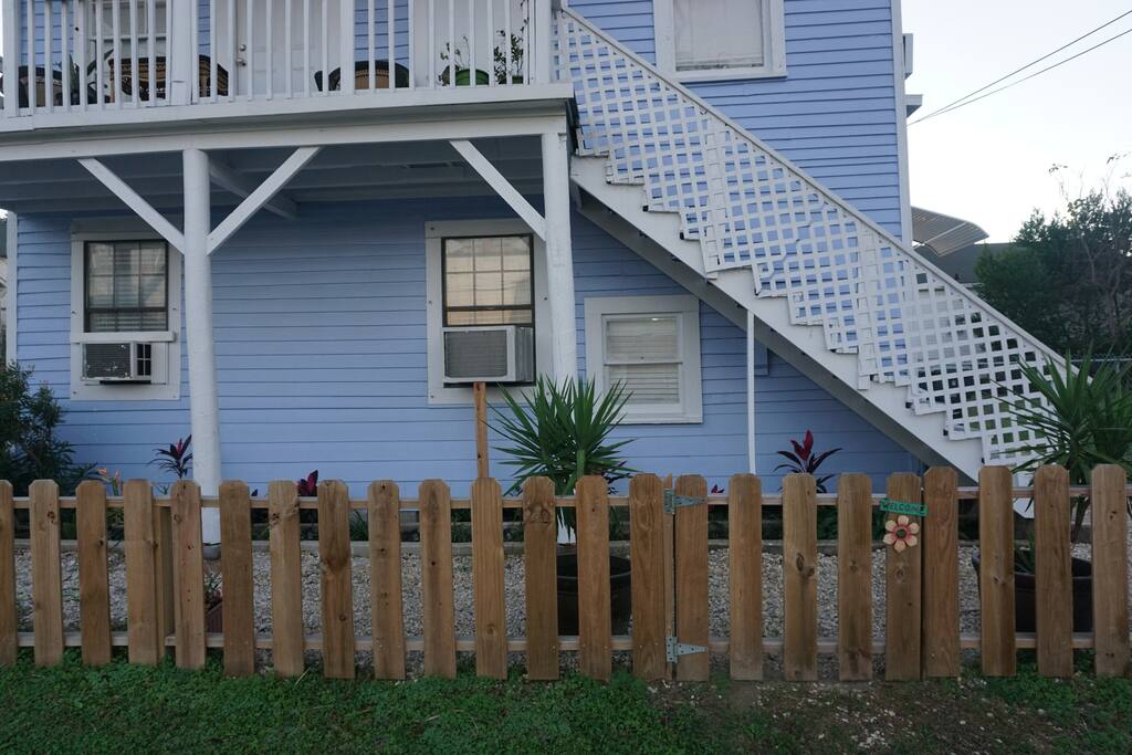 Small gate - with welcome sign, can be accessed to enter the property. Unit 3's front door is on the right side.