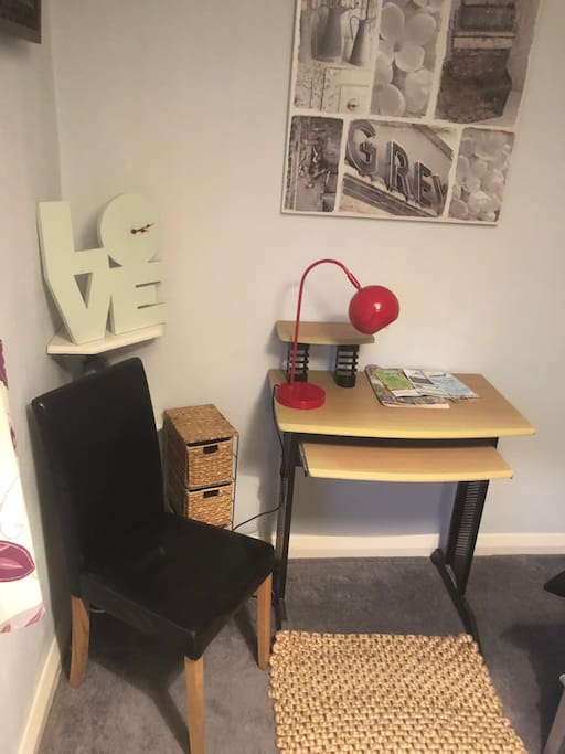 Desk in room with two chairs