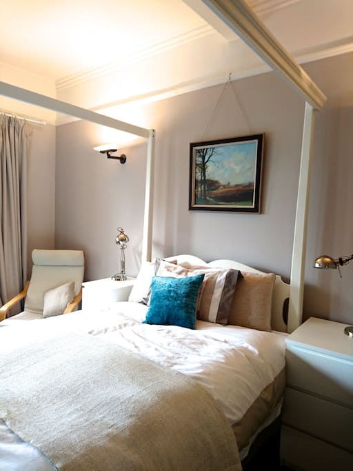 Modern white four poster bed - very comfy !
