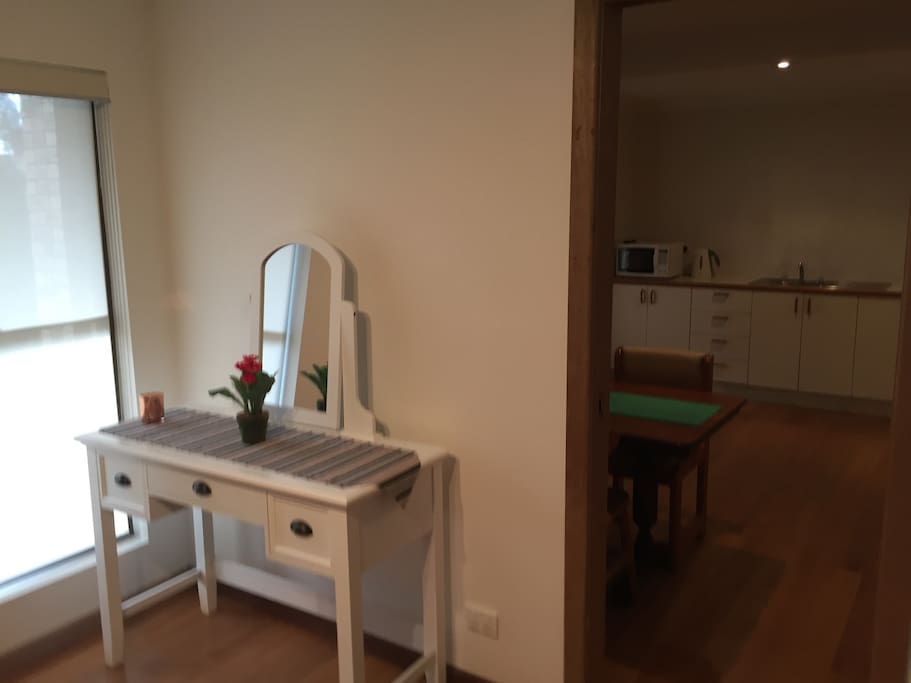 Dressing table/desk and unlimited wireless internet access. Bedroom adjacent to kitchen/living area (with lockable sliding door)
