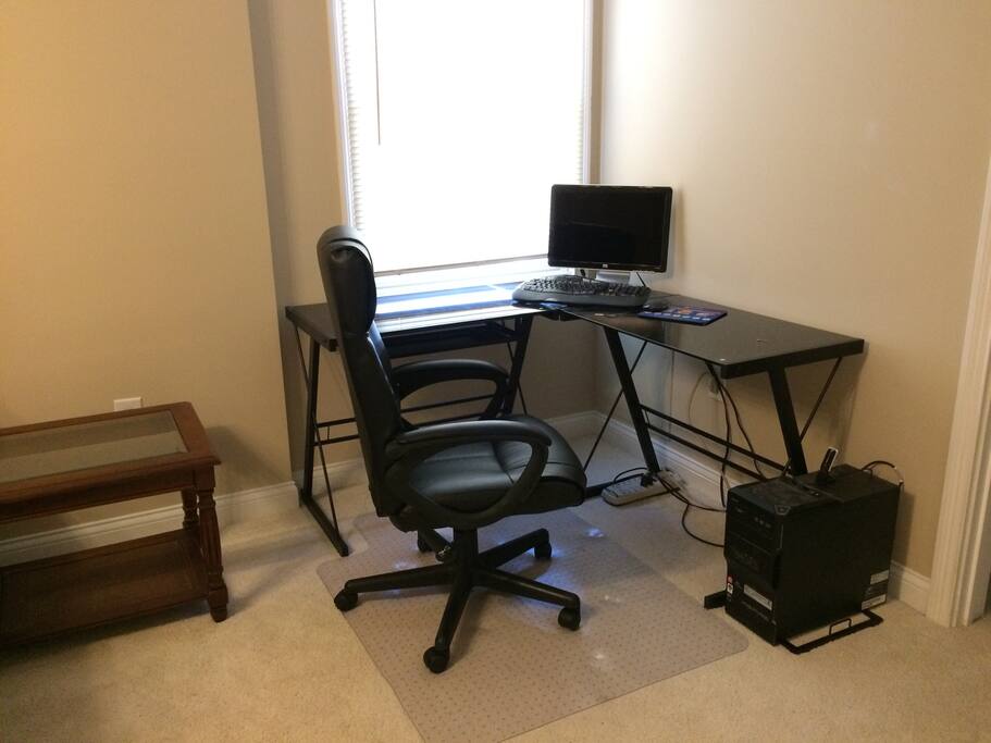 New glass desk and computer available for use