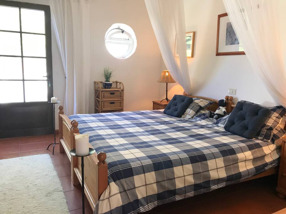 King size bed with a view out
onto the private terrace.