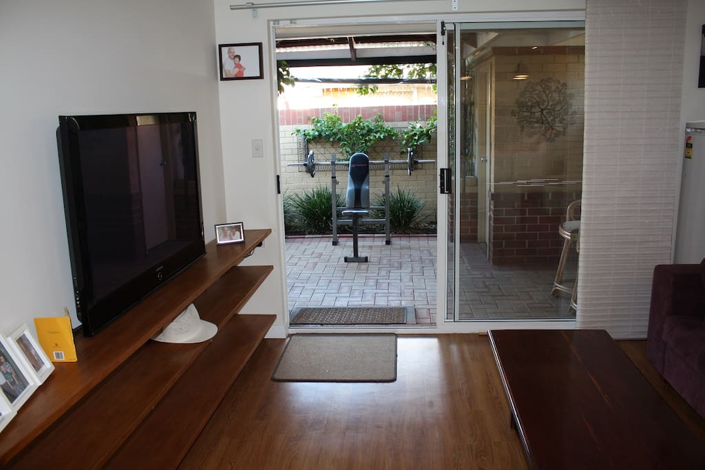 Living area and TV room adjoins the kitchen and dinning area