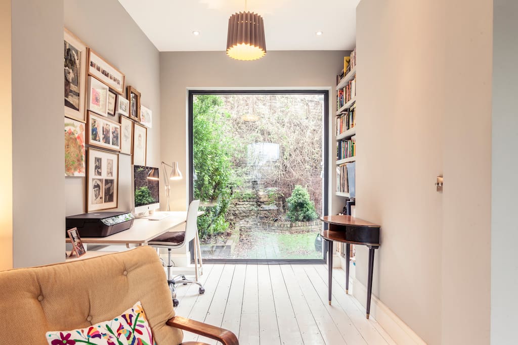 View from sitting room to office with floor to ceiling glass panel - lots of lovely natural light!