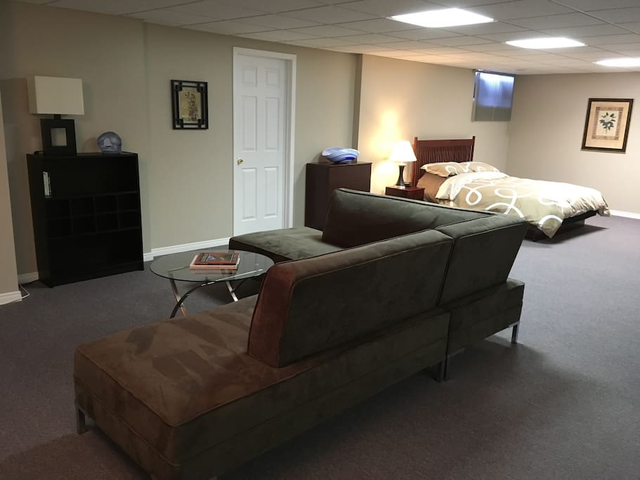 Comfortable sitting area next to queen size bed.