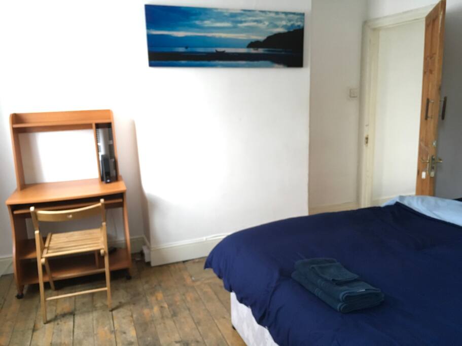 First floor: Large bedroom with desk, chair and Virgin fibre optic broadband with a WIFI router