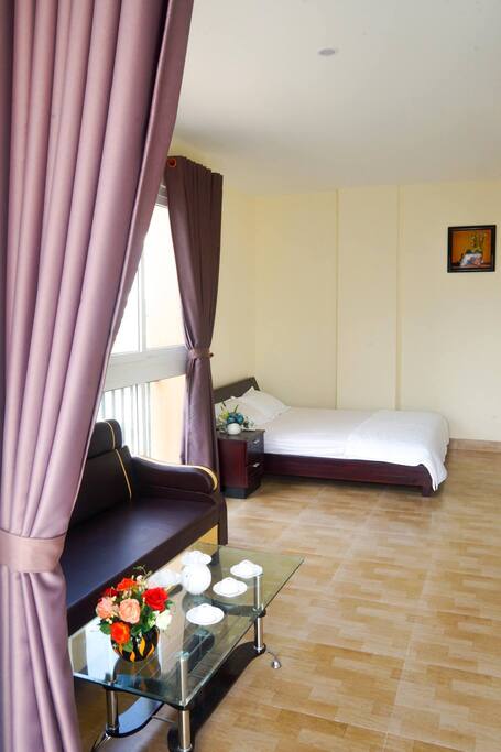 Lovely bed with sunlight and big window