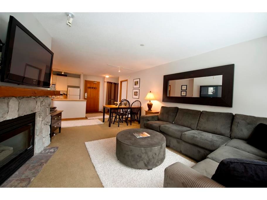 Living room with gas fireplace and pull out sofe.