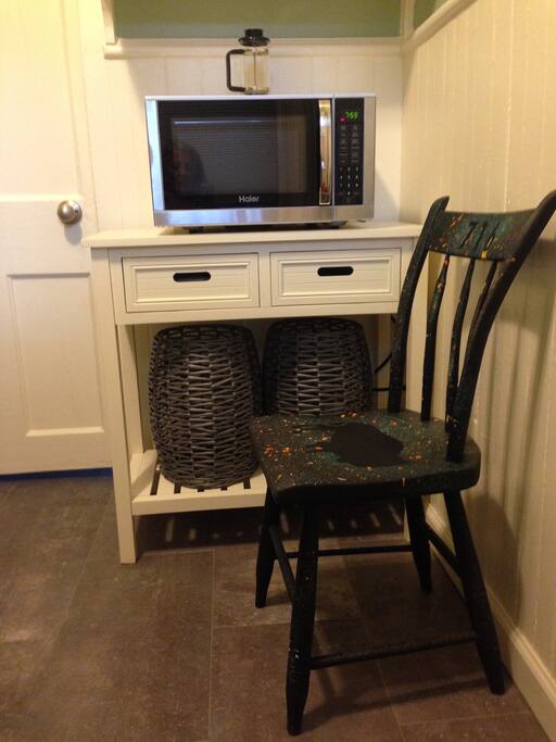 Galley kitchen with table and chairs