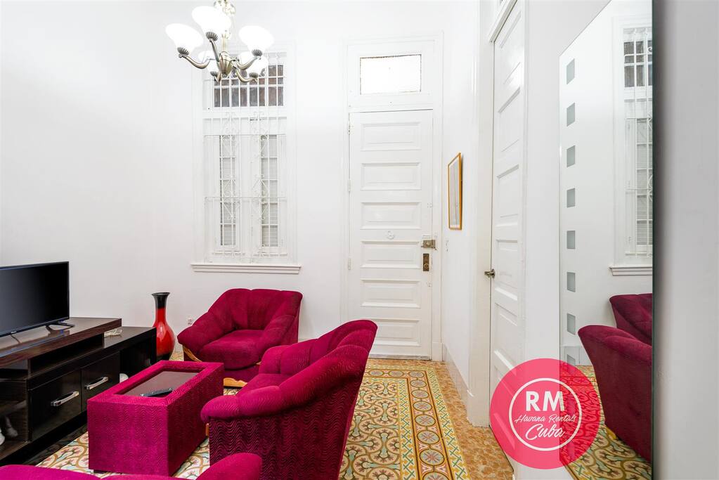 living room and view of the entrance door on the background.