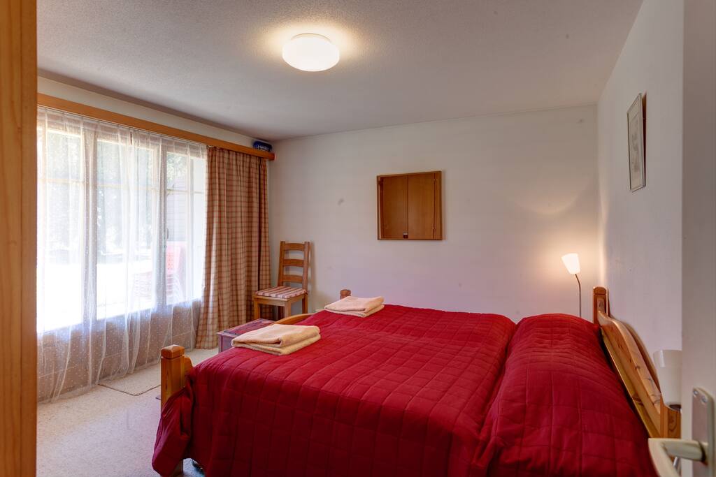 Double bedroom with doors onto terrace.