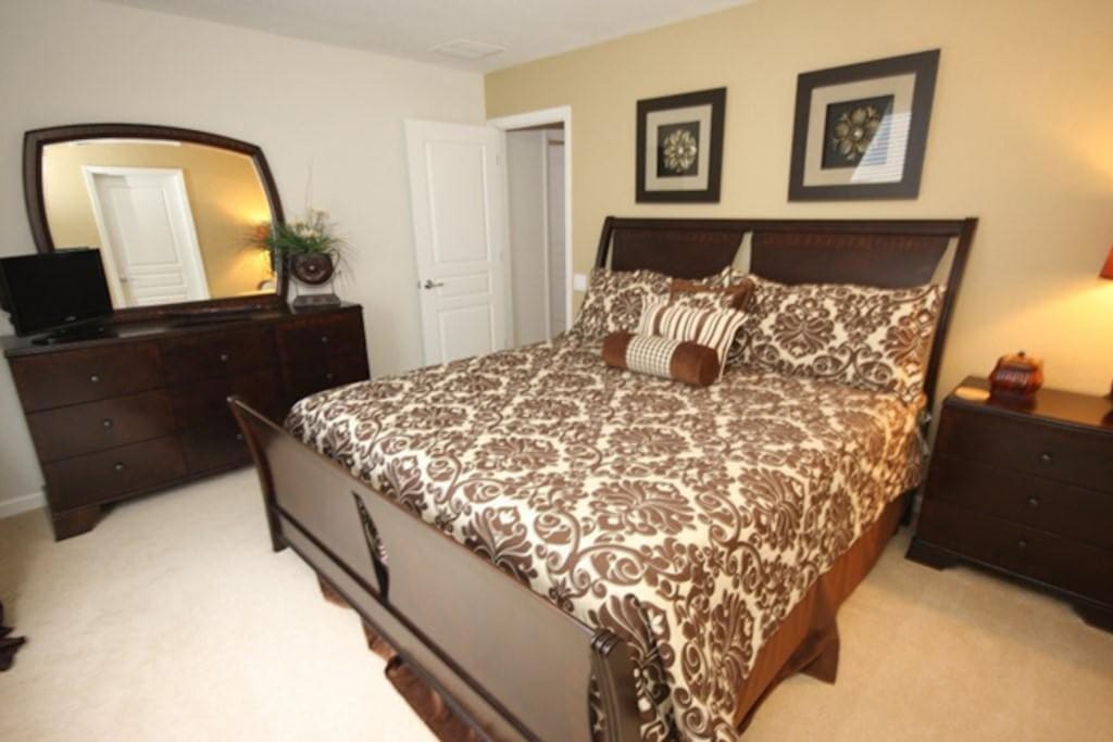Take in your luxurious surroundings in the king master bedroom